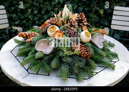 An autumnal arrangement for the garden or as a decoration for the graves on the Christian festivals of All Saints and All Souls` Stock Photo